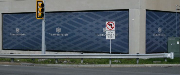 This photo shows the intersection and signpost with the removed sign.
